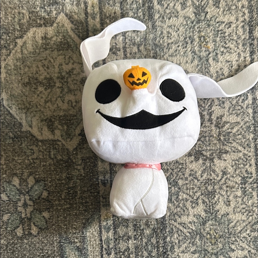 White Plush Toy with Pumpkin and Black Accents